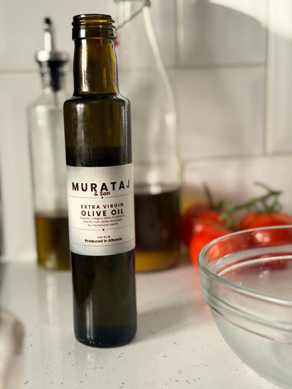 Murataj & Son Reserve extra virgin olive oil, 250ml green glass bottle on a kitchen counter
