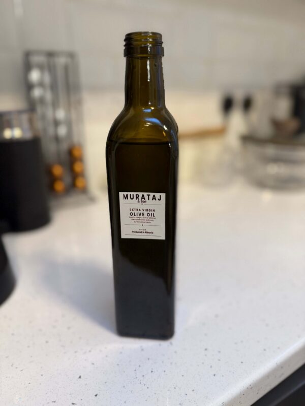 Murataj & Son Extra Virgin Olive Oil 500ml bottle on kitchen counter.